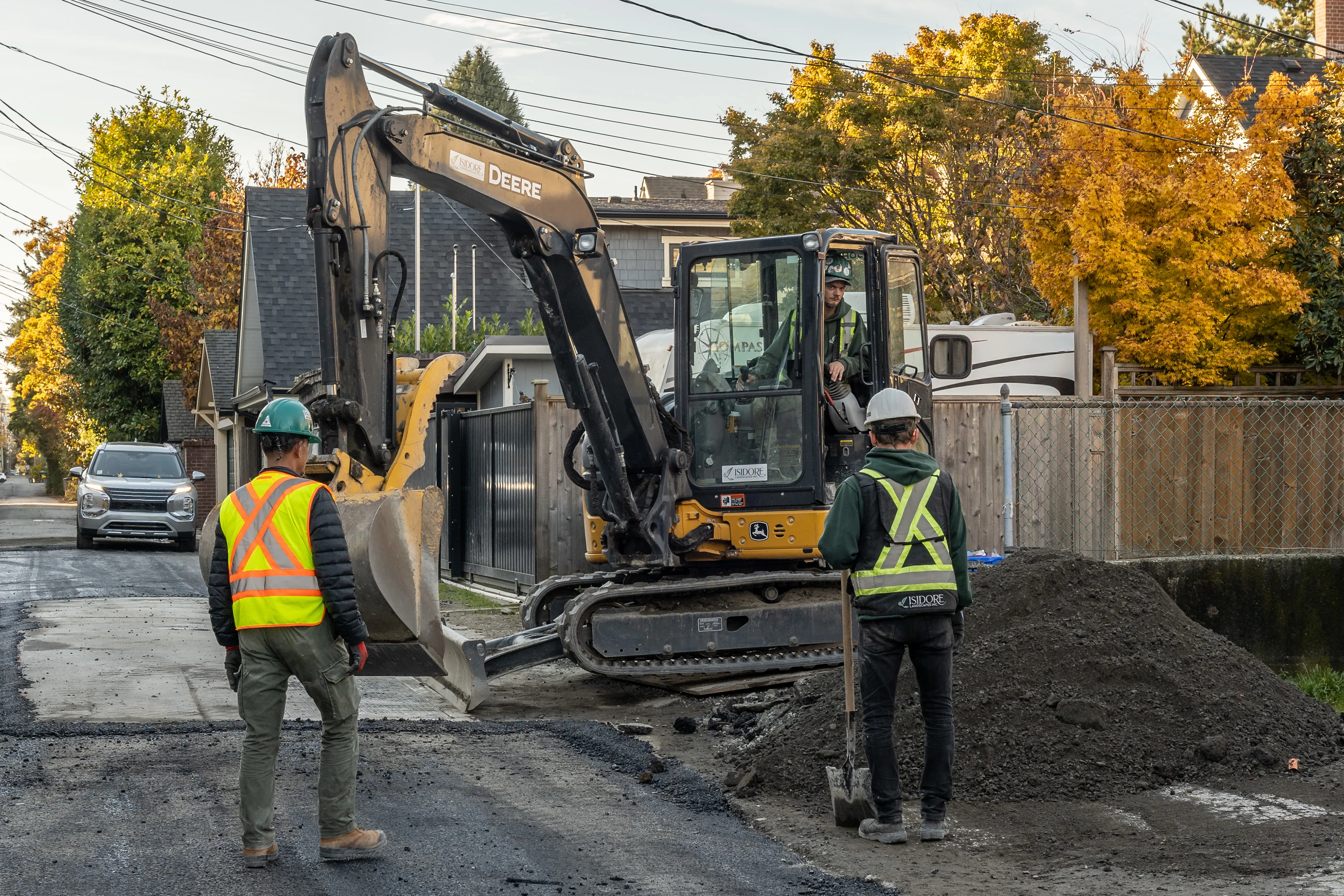 Crew with an excavator preparing a residential site