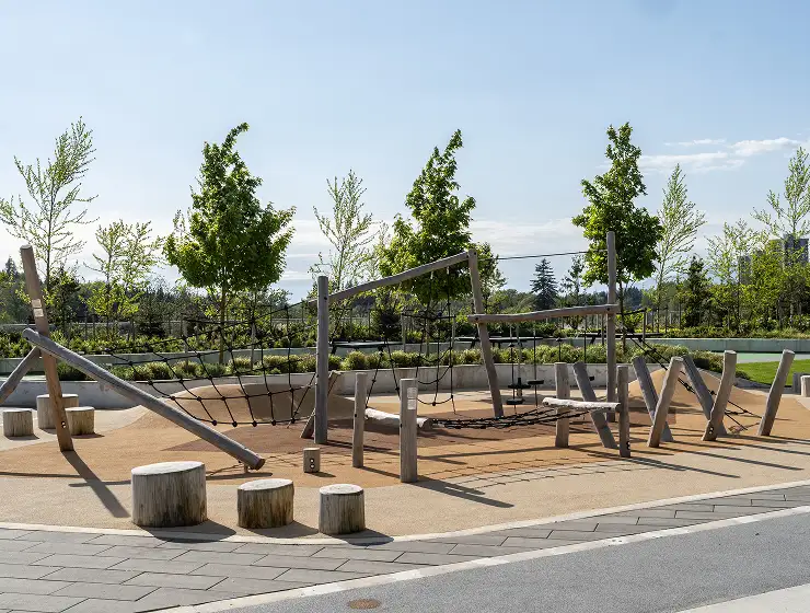 Timber play structure with log stepping stumps in a playground