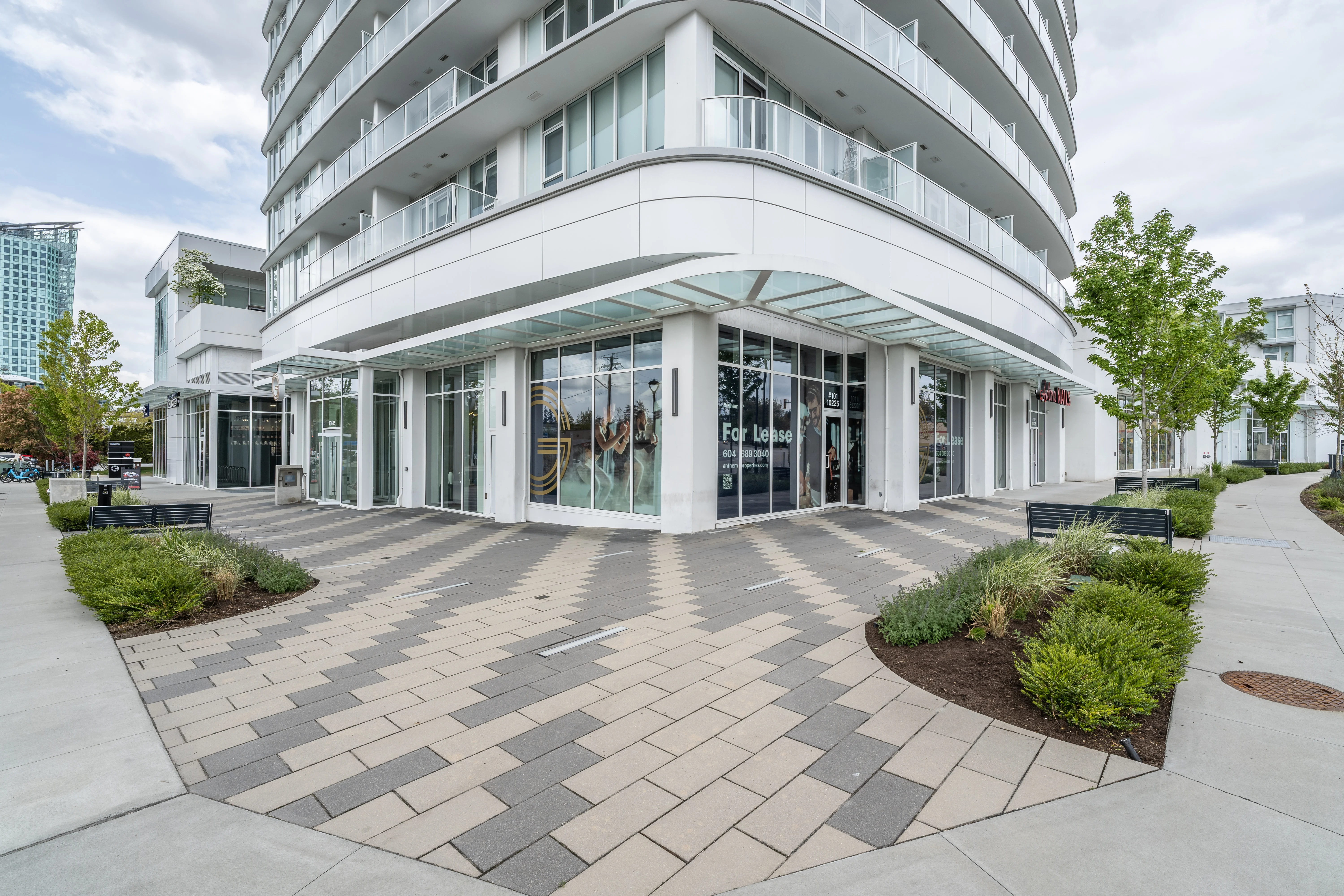Patterned paver plaza at the corner of a residential building at Georgetown